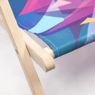 Lounger with armrest